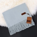 Soft grey cashmere scarf with elegant tassel details and premium brand label finish - Grey Blue