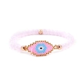 Macro shot of a handmade Miyuki bead evil eye bracelet with soft pink crystals - Pink Evil Eye / Light Pink