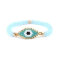 Detailed view of handmade Miyuki bead evil eye bracelet with blue and gold faceted beads - Classic Evil Eye / Sky Blue