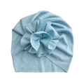 Detail of light blue ribbed cotton baby turban hat with a large floral fold decoration - Sky Blue