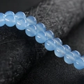 Cuentas redondas de calcedonia natural azul claro para creación de joyas y manualidades - Aguamarina