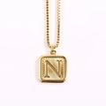 Square gold pendant necklace with embossed letter N and sunburst texture on box chain - Letter N