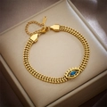 Golden stainless steel wheat chain bracelet featuring a blue devil's eye charm pendant - Evil Eye Bracelet (B732) / Gold