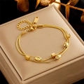 Detail of gold double-layer chain bracelet with textured beads on a jewelry box - Geometric Decorative Beads Double Chain Style (B760)