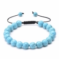 Close-up of turquoise beaded bracelet with black veins and adjustable cord on white background - Turquoise