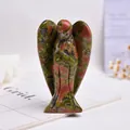 Detailed view of hand-carved unakite crystal angel figurine with natural green and red textures - Unakite