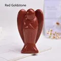 Macro view of carved angel ornament made of red goldstone with sparkling texture - Red Goldstone