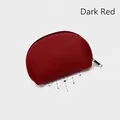 Detail of wine red semi-circle pouch with contrast stitching and silver zipper closure - Wine Red