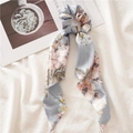 Light blue floral satin hair scrunchie with elegant ribbons on a soft white background - Triangle Streamer / Light Blue