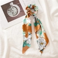 Floral print hair scrunchie with long ribbons in mustard yellow on linen background - Triangle Streamer / Orange