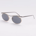 Occhiali da sole ovali in metallo con lenti UV grigie e ponte dorato chic - Montatura Oro Canna di Fucile Lenti Grigie