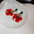Detail of flower earrings featuring red petals, green gemstones, and sparkling crystals - Red Flower Green Gem Rhinestone Vintage Drop
