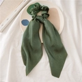 Deep green satin scrunchie with long ribbon bow on a white ceramic display tray - Dark Green