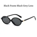 Oval black frame sunglasses with dark gray lenses and gold hinge accents - Black Frame Black Grey Lens
