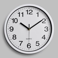 Classic 10-inch white plastic wall clock with black numerals and quartz movement - White