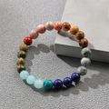 Bohemian natural stone beaded bracelet with colorful agate and tiger eye on a grey block - Multi-color