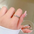 Detail of minimalist titanium steel ring featuring a single brilliant-cut zircon accent - US 8 / Silver Style (R117 Steel)