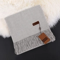 Morandi grey cashmere scarf with twisted fringe tassels on soft white faux fur surface - Light Gray