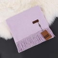 Folded light purple cashmere scarf with soft fringes on elegant white fur backdrop - Taro Purple