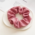 Pink faux leather scrunchie with pleated texture on white decorative tray - Leather Pink
