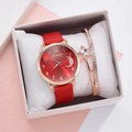 Close-up of rose gold watch set with red leather strap and matching moon star bracelet - Watch + Bracelet + Box / Red