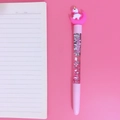 Pink unicorn liquid quicksand gel pen with silver glitter on a matching background - Pink Moon Unicorn