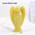 Close-up of a hand-carved Green Olive Jade angel figurine with a translucent finish - Olive Jade