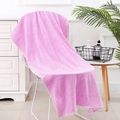 Detailed texture of thick purple coral fleece bath towel hanging on a white chair - Plain Taro Purple