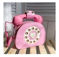 Detail view of pink vintage telephone bag with rotary dial and heart-shaped center - Pink