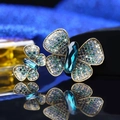Detailed pair of gold-toned butterfly brooches with blue and green rhinestones - Lake Blue Gradient Double Butterfly
