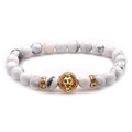 White marble beaded lion head bracelet with gold accents on a clean white background - White Turquoise With Rhinestone