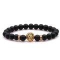 Macro detail of black matte beaded bracelet featuring a golden lion head and crystal rings - Matte Black Stone With Rhinestone
