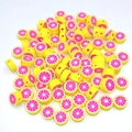 Macro detail of 10mm fruit polymer clay beads with pre-drilled holes for DIY jewelry - Grapefruit