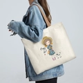 Off-white canvas tote bag with brown straps featuring a cute Happy Girl cartoon print - Happy Girl - Beige