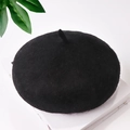 Classic black wool beret hat for kids and toddlers with a soft texture on white background - One Size / Black