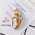 Detail view of 52x23mm marble pattern shell pendant with gold-plated decorative edges - Style 1# Marble Texture (52*23mm)