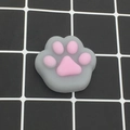 Squishy cat paw stress relief toy in grey and pink silicone with a matte finish - Grey and Pink Cat Paw