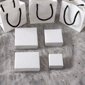 White textured jewelry boxes and gift bags set on a grey fur background with stars - 7*7*3 With Sponge / White