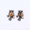 Pair of vintage silver owl brooches featuring tiger eye stone inlay on white background - Tiger's Eye