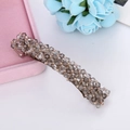 Macro shot of smoky grey crystal beads on a metal spring hair clip for women - Gray