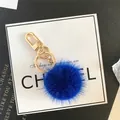 Furry royal blue mink pompom keychain with golden metal clasp for handbag decor - Sapphire Blue
