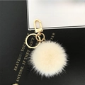 Plush mink fur ball keychain in cream white with golden metal clasp for bags - Off White