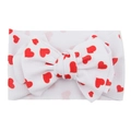 Baby headband with large red heart print bow on white fabric texture - #5 Hearts