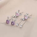 Detail of bunny stud earrings set with purple and pink zircon stones on satin - 3 Pairs Set / Silver
