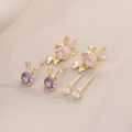 Detailed view of cute rabbit earrings set with purple, pink and white cubic zirconia stones - 3 Pairs Set / Gold