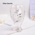 Close-up of clear quartz angel statue showing natural ice cracks and crystal texture - White Crystal