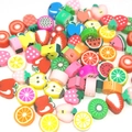 Detailed close-up of mixed colorful fruit polymer clay beads for DIY craft bracelets - Multicolor