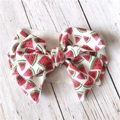 Detailed close-up of a wide fabric headband featuring a 3D large watermelon print bow - Watermelon
