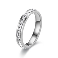 Detailed close-up of eternity band with princess cut zircon and channel setting - US 9 / 4 mm / Silver