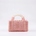 Borsa a mano in perle intrecciate a mano con corpo rosa e manici avorio bianco - Rosa